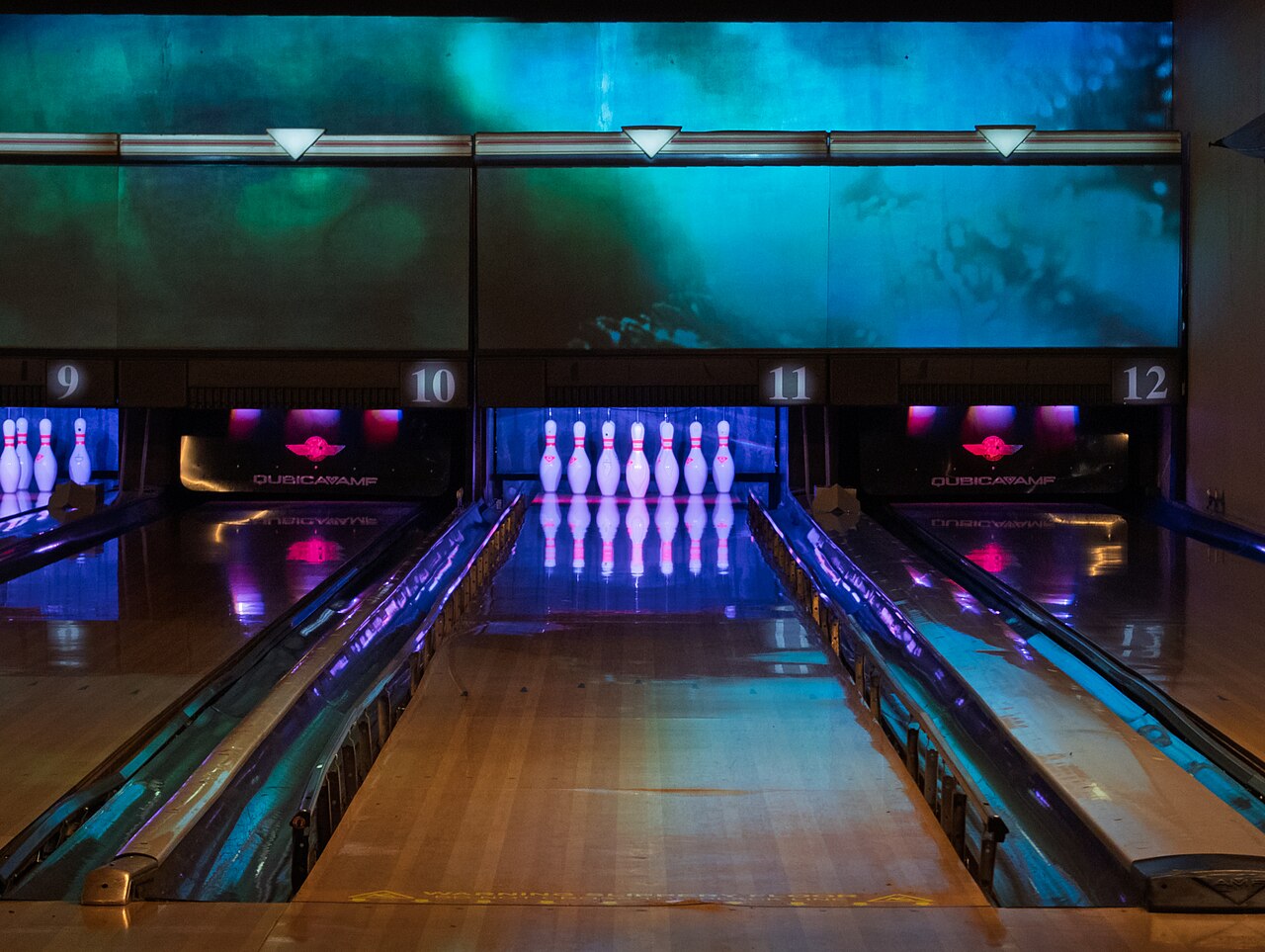 Lit bowling lanes and pins inside Rowans, Finsbury Park